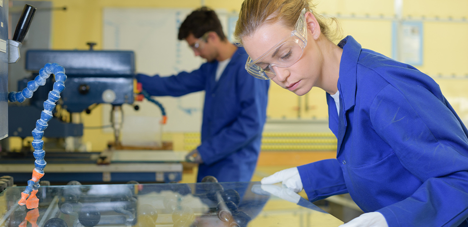 Operators working on an industrial glass line.